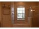 Bathroom with bathtub, shower, and window at 10312 Cleghorn Dr, San Antonio, FL 33576