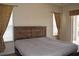Primary bedroom with a king-size bed and neutral decor at 10312 Cleghorn Dr, San Antonio, FL 33576