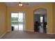 Living room with view of the pool and access to another room at 10312 Cleghorn Dr, San Antonio, FL 33576