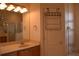 Bathroom with sink, shower, and linen closet at 10312 Cleghorn Dr, San Antonio, FL 33576