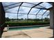Screened-in pool with a view of the golf course at 10312 Cleghorn Dr, San Antonio, FL 33576