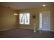 Bright dining room with neutral carpeting and access to the foyer at 10312 Cleghorn Dr, San Antonio, FL 33576