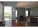 Bright dining area with wood table and bench, view of pool at 10312 Cleghorn Dr, San Antonio, FL 33576