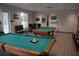 Community game room featuring two billiard tables and comfortable seating at 10312 Cleghorn Dr, San Antonio, FL 33576