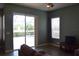 Living room with sliding glass doors leading to the pool area at 10312 Cleghorn Dr, San Antonio, FL 33576
