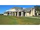 Elegant clubhouse with stone accents and covered patio at 10312 Cleghorn Dr, San Antonio, FL 33576