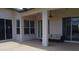 Covered patio with seating area and access to the pool at 10312 Cleghorn Dr, San Antonio, FL 33576