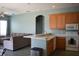 Kitchen with light wood cabinets and an island at 10312 Cleghorn Dr, San Antonio, FL 33576