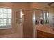 Bathroom with shower, bathtub, and double vanity at 10312 Cleghorn Dr, San Antonio, FL 33576