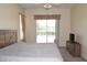 Bedroom with pool view and sliding glass doors at 10312 Cleghorn Dr, San Antonio, FL 33576