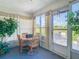 Bright sunroom with table and chairs, access to patio at 11247 Corey Pavin Ln, San Antonio, FL 33576