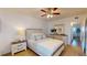 Bright bedroom with queen-size bed, dresser, and nightstand at 2461 Canadian Way # 65, Clearwater, FL 33763