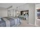 Cozy bedroom featuring a mirrored closet and views of the balcony and nearby ocean at 1651 Sand Key Estates Ct # 74, Clearwater Beach, FL 33767