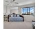 Cozy bedroom with a daybed and a large window overlooking the beautiful city view at 1651 Sand Key Estates Ct # 74, Clearwater Beach, FL 33767
