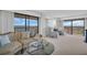 Bright living room with comfortable seating, large windows, and stunning waterfront views at 1651 Sand Key Estates Ct # 74, Clearwater Beach, FL 33767