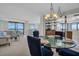 Open concept living space with dining area and sweeping views at 1651 Sand Key Estates Ct # 74, Clearwater Beach, FL 33767