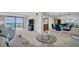 Open concept living space features a relaxing seating area and adjacent dining area at 1651 Sand Key Estates Ct # 74, Clearwater Beach, FL 33767
