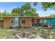 House exterior showcasing a side view and backyard patio at 4984 Oxford N Ave, St Petersburg, FL 33710