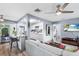 Open concept kitchen and living area with modern kitchen and a grey sectional sofa at 4984 Oxford N Ave, St Petersburg, FL 33710