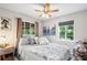 Cozy bedroom with a queen-size bed and large window at 4984 Oxford N Ave, St Petersburg, FL 33710