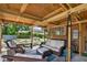 Relaxing covered patio with seating area, perfect for outdoor entertaining at 4984 Oxford N Ave, St Petersburg, FL 33710