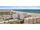 Aerial view of beach front property with pool and parking at 5830 Midnight Pass Rd # 705, Sarasota, FL 34242