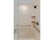Walk-in shower with grab bars and tiled walls at 5830 Midnight Pass Rd # 705, Sarasota, FL 34242