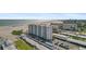 Aerial view of beach front property with parking and ocean view at 5830 Midnight Pass Rd # 705, Sarasota, FL 34242