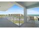 Balcony with ocean view and outdoor seating at 5830 Midnight Pass Rd # 705, Sarasota, FL 34242