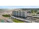 Aerial view of beach front property with pool and parking at 5830 Midnight Pass Rd # 705, Sarasota, FL 34242
