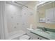 Clean bathroom with a bathtub and green vanity at 5830 Midnight Pass Rd # 705, Sarasota, FL 34242