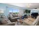 Living room with comfortable seating and ocean view at 5830 Midnight Pass Rd # 705, Sarasota, FL 34242