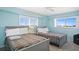 Guest bedroom with two twin beds and ocean view at 5830 Midnight Pass Rd # 705, Sarasota, FL 34242