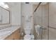 Bathroom with shower, toilet and granite countertop at 5830 Midnight Pass Rd # 705, Sarasota, FL 34242