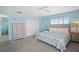 Spacious bedroom with king-size bed and dresser at 5830 Midnight Pass Rd # 705, Sarasota, FL 34242