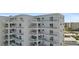 White building exterior with multiple balconies at 5830 Midnight Pass Rd # 705, Sarasota, FL 34242