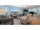 Living room with comfortable seating and ocean view at 5830 Midnight Pass Rd # 705, Sarasota, FL 34242