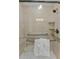 Walk-in shower with grab bars and tiled walls at 5830 Midnight Pass Rd # 705, Sarasota, FL 34242