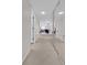 Long hallway with mirrored walls and carpeting at 1651 Sand Key Estates Ct # 74, Clearwater Beach, FL 33767
