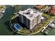 Aerial view of condo building, pool and private marina at 1651 Sand Key Estates Ct # 74, Clearwater Beach, FL 33767