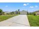 Single-Gathering home with a two-car garage and driveway at 7162 Benson St, Englewood, FL 34224