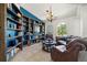 Cozy library featuring built-in bookshelves and comfortable seating at 7162 Benson St, Englewood, FL 34224