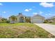 Single-Gathering home with a two-car garage and driveway at 7162 Benson St, Englewood, FL 34224