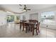 Bright dining room with wooden table and chairs, and access to the backyard at 7162 Benson St, Englewood, FL 34224
