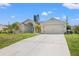 Single-Gathering home with a two-car garage and driveway at 7162 Benson St, Englewood, FL 34224