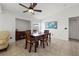 Dining room with wood table and chairs, ceiling fan, and tiled floor at 7162 Benson St, Englewood, FL 34224