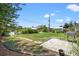 Large backyard with a patio and grilling area at 7162 Benson St, Englewood, FL 34224