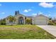 Single Gathering home with two car garage and landscaping at 7162 Benson St, Englewood, FL 34224