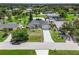 Aerial view of a single-Gathering home with a driveway at 7162 Benson St, Englewood, FL 34224