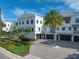 Modern three-story building with garage parking at 158 Brightwater Dr # 1, Clearwater Beach, FL 33767